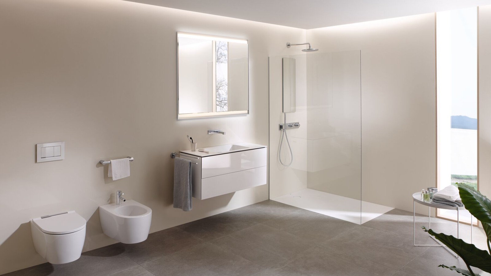 A look a inside with a large bathroom with Geberit AquaClean Mera shower toilet, bathroom furniture and bathroom ceramics