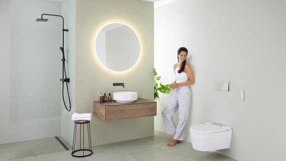 Woman in front of bathroom mirror Woman in front of bathroom mirror