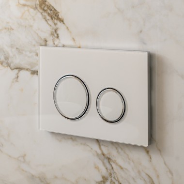 White Geberit Sigma50 actuator plate with design rings in silver
