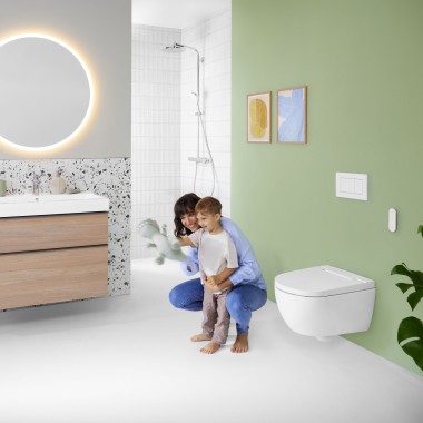 Woman and child in a colourful bathroom with Geberit Option mirror