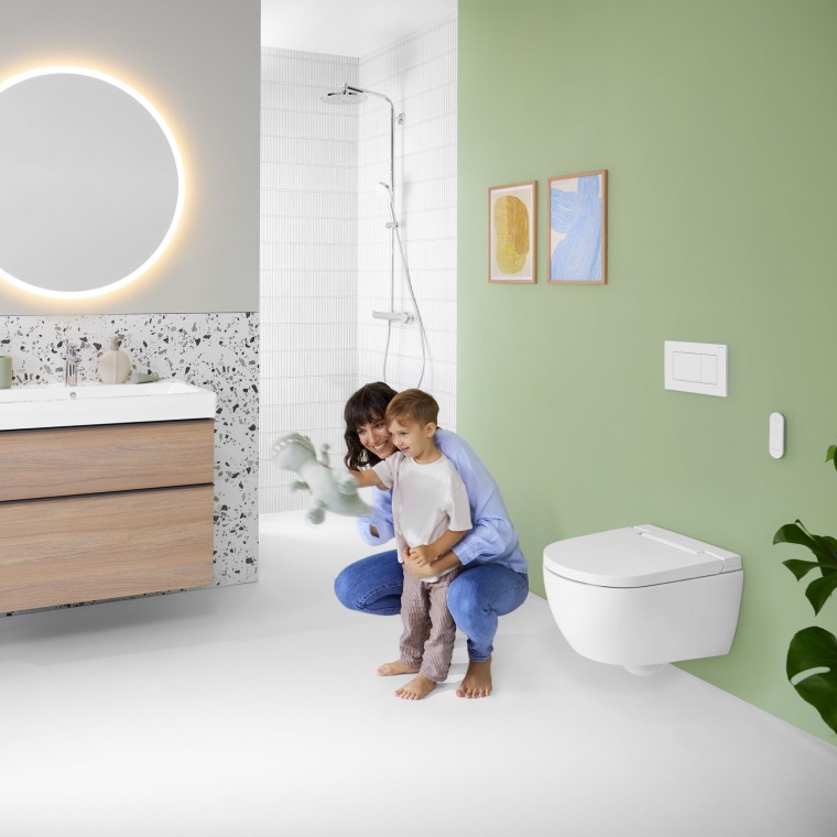 Woman and child in a colourful bathroom with Geberit Option mirror Woman and child in a colourful bathroom with Geberit Option mirror