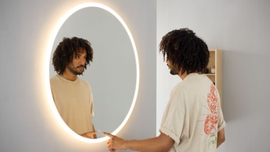 Man looking in Option mirror round