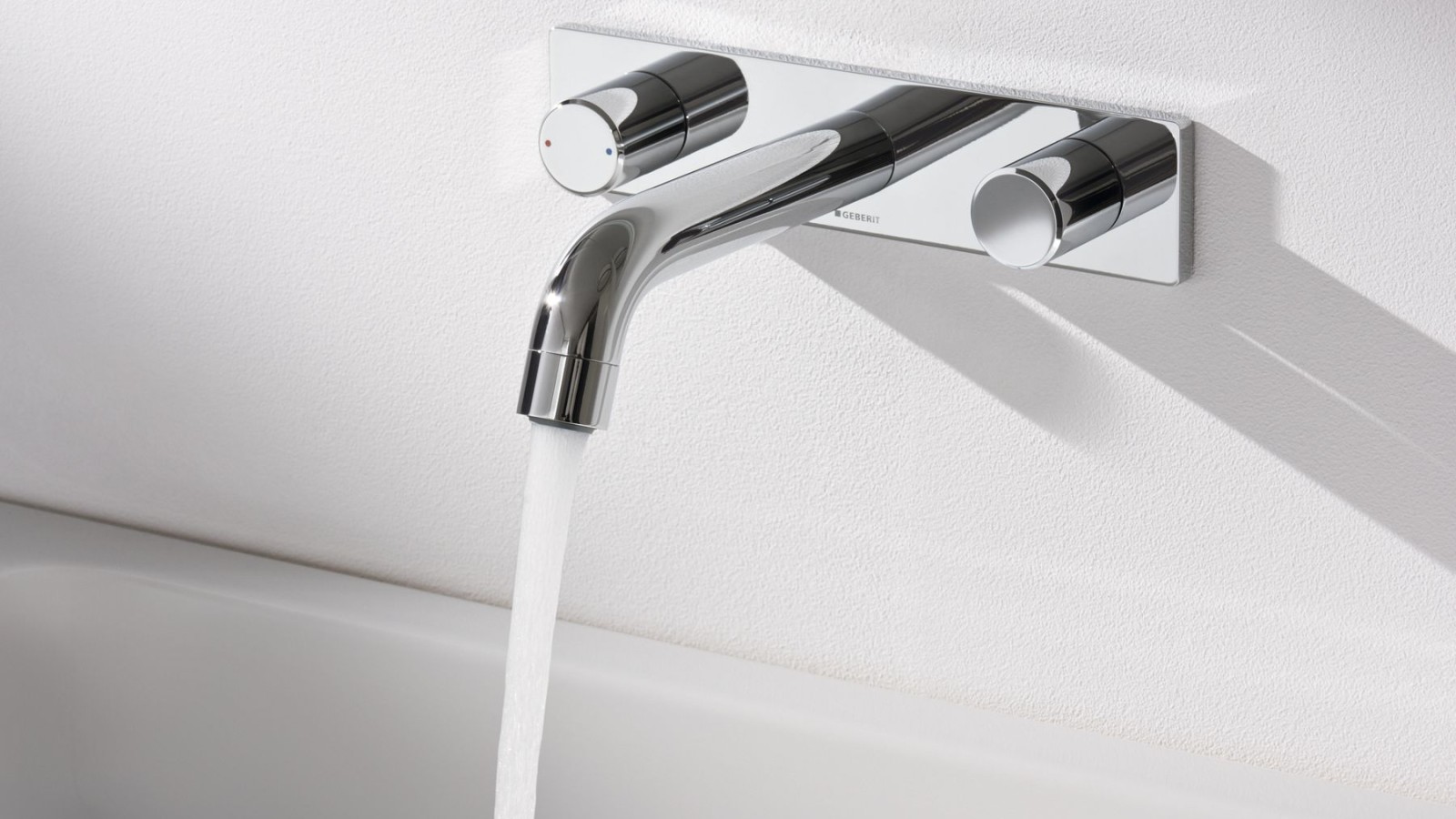 Geberit wall-mounted taps with running water Geberit wall-mounted taps with running water