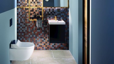 Gold and copper tones add warmth to this guest WC Gold and copper tones add warmth to this guest WC