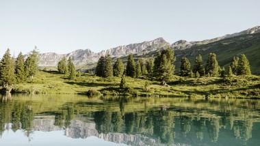 Reflections in the Swiss mountain lake Engstlensee at 1,835 metres above sea level