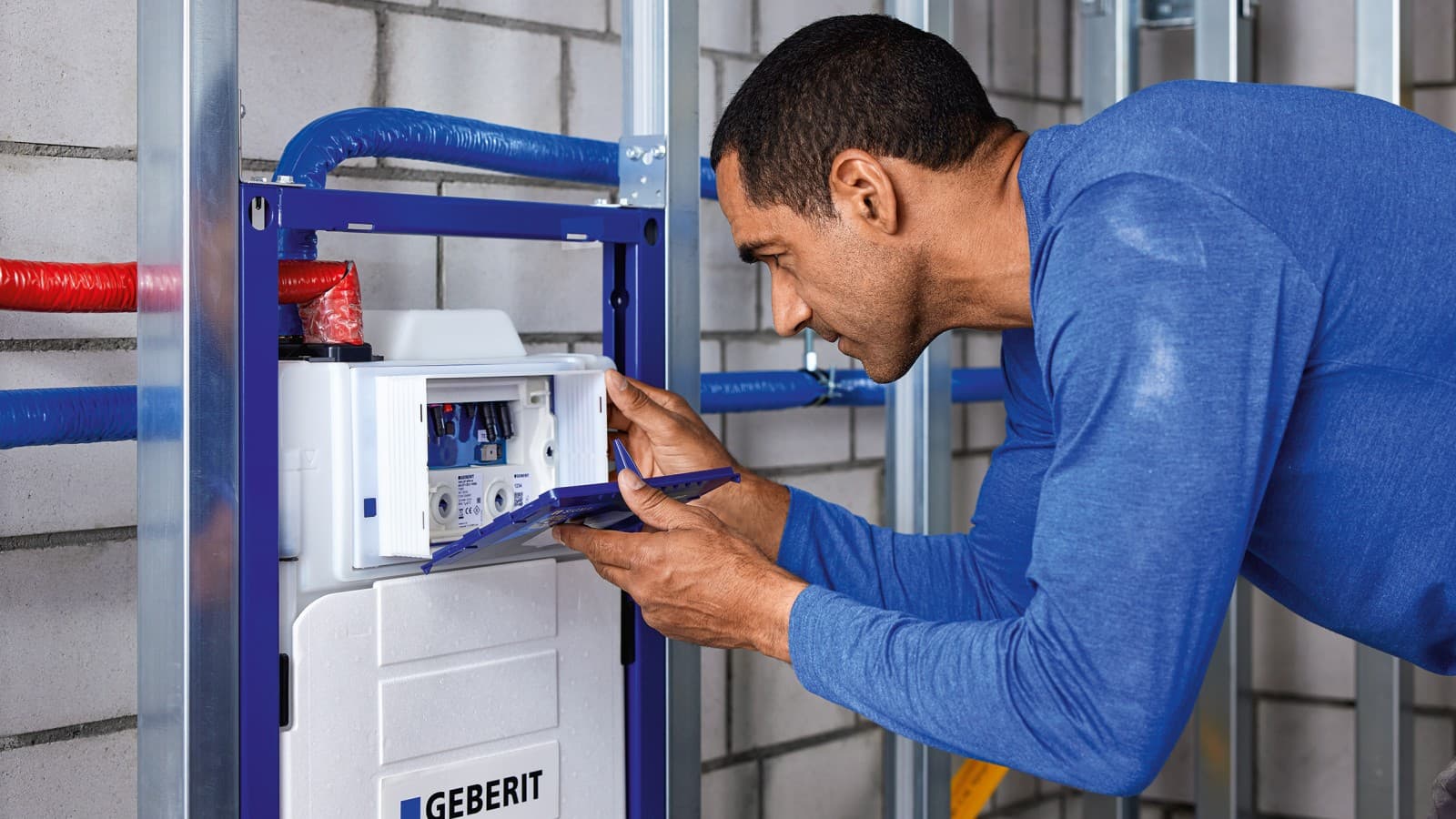Man installing the Geberit Hygiene System Man installing the Geberit Hygiene System